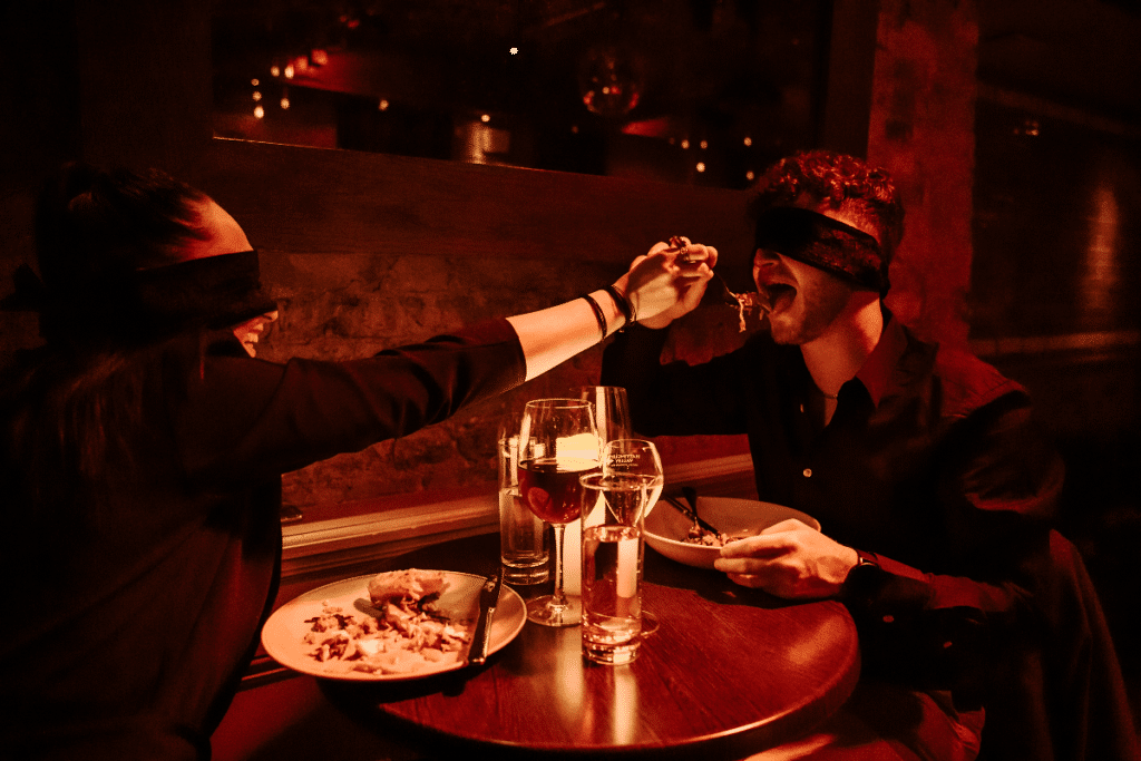 Image showing two guests enjoy a blindfolded Dining in the Dark experience
