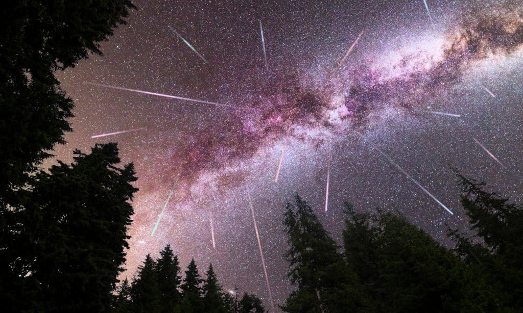 Photo of meteors shooting across a starry night sky