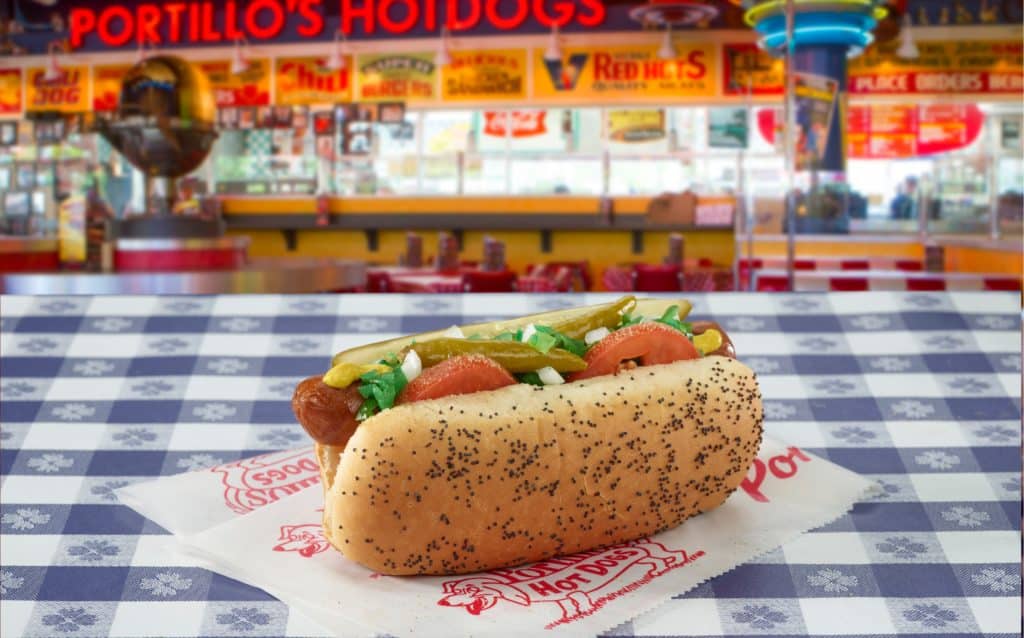 Photo of a Portillo's hotdog on a counter at a Portillo's restaurant similar to those coming to North Texas this year