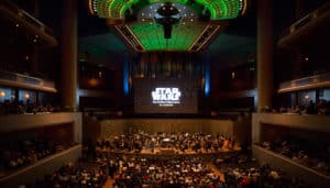 Photo of Dallas Symphony orchestra on stage performing a concert alongside a screening of Star Wars at the Morton H. Meyerson Symphony Center in Dallas